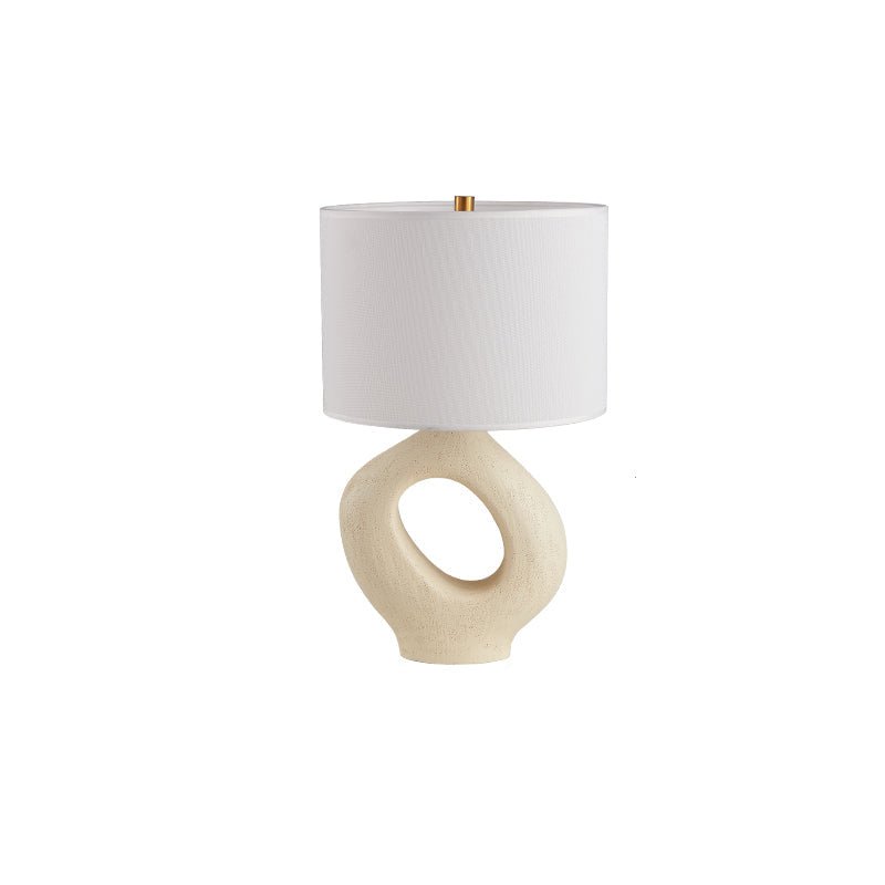 Based on the provided data:1. Core product: Table Lamp
2. Selling points: Sculptural design, ceramic base, available colors, fabric shade
3. New title: Sculptural Table Lamp | Ceramic Base | Beige, Black, White, Grey