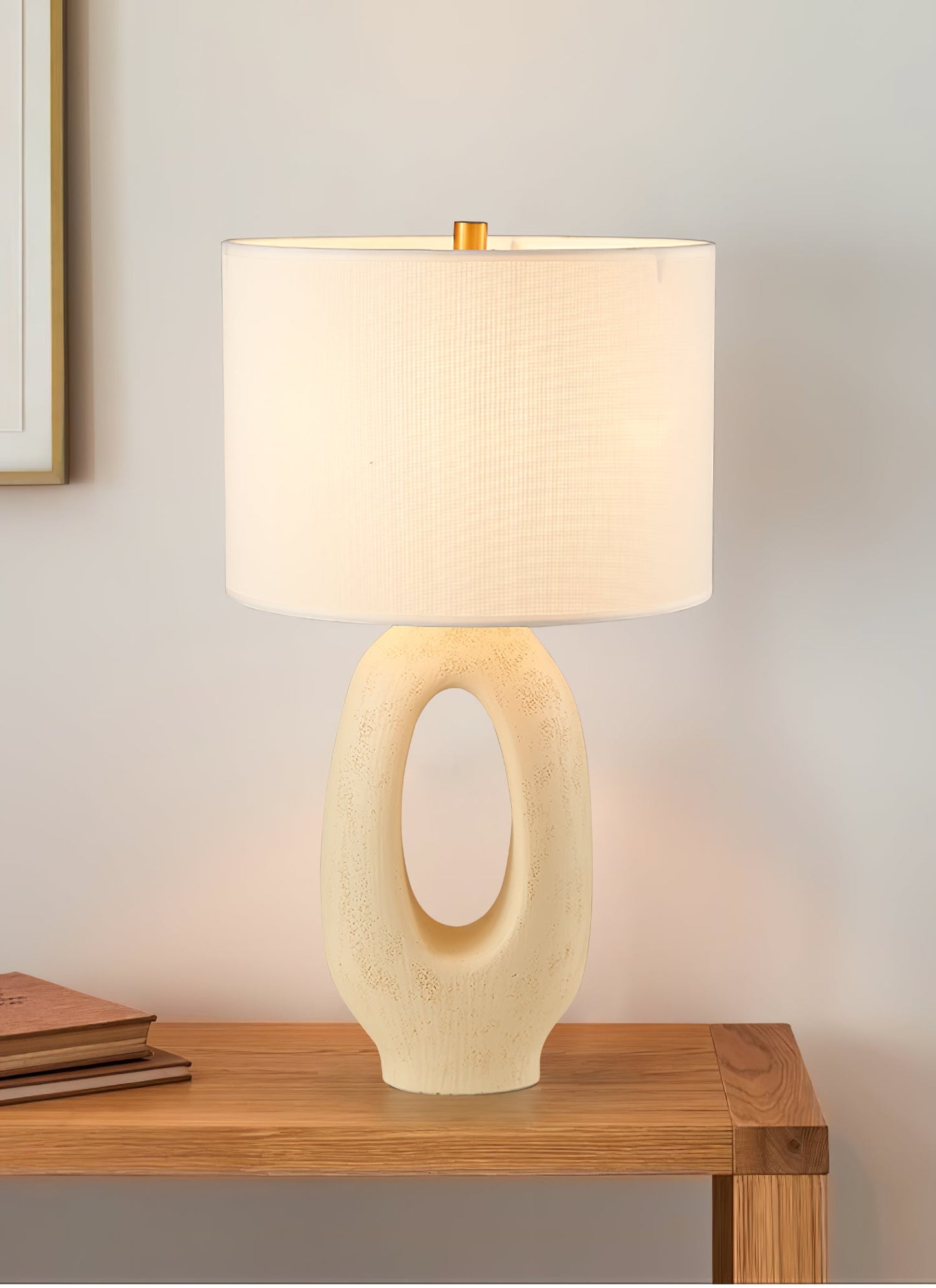 Based on the provided data:1. Core product: Table Lamp
2. Selling points: Sculptural design, ceramic base, available colors, fabric shade
3. New title: Sculptural Table Lamp | Ceramic Base | Beige, Black, White, Grey