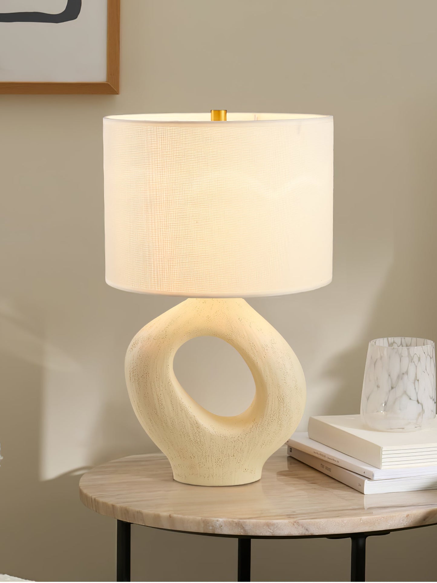 Based on the provided data:1. Core product: Table Lamp
2. Selling points: Sculptural design, ceramic base, available colors, fabric shade
3. New title: Sculptural Table Lamp | Ceramic Base | Beige, Black, White, Grey