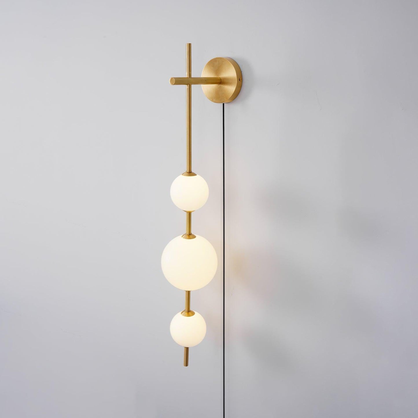 Vertical Globe Wall Lamp | Brass & Metal | Matte White Glass Shade