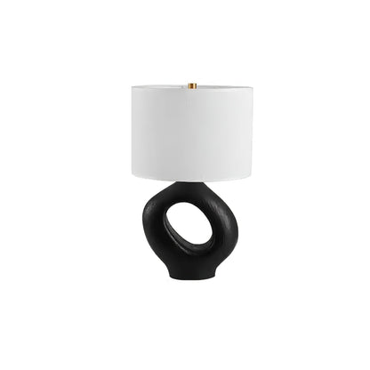 Based on the provided data:1.  Core product: Table Lamp
2.  Selling points: Sculptural design, ceramic base, available colors, fabric shade
3.  New title: Sculptural Table Lamp | Ceramic Base | Beige, Black, White, Grey
