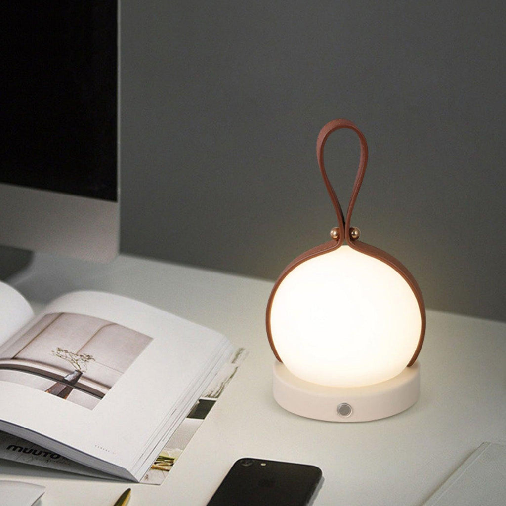 Based on the data provided:1.  Core product: Table Lamp
2.  Selling points: Built-in Battery, Lantern, Material: Iron, PE, Imitation leather cord.
3.  New title: Bola Lantern Table Lamp | Iron, PE, Imitation Leather Cord | Built-in Battery