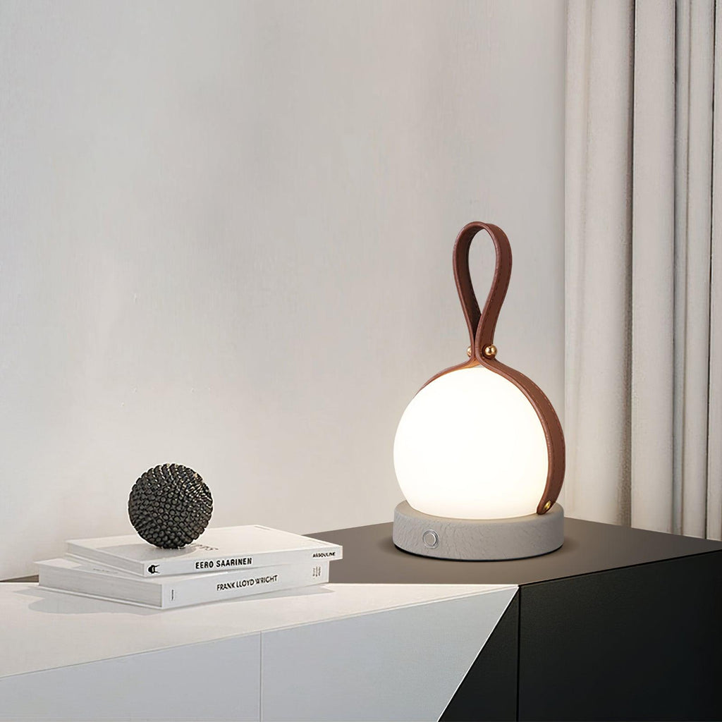 Based on the data provided:1.  Core product: Table Lamp
2.  Selling points: Built-in Battery, Lantern, Material: Iron, PE, Imitation leather cord.
3.  New title: Bola Lantern Table Lamp | Iron, PE, Imitation Leather Cord | Built-in Battery