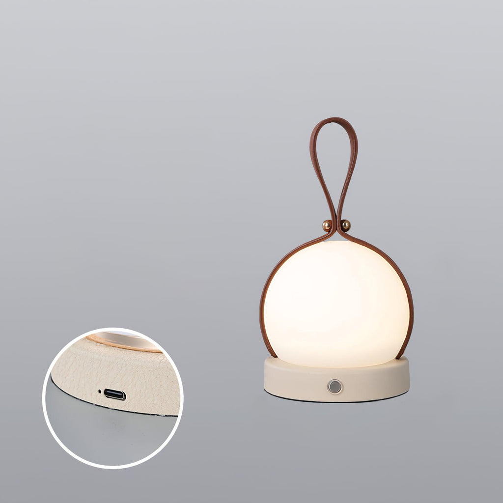 Based on the data provided:1.  Core product: Table Lamp
2.  Selling points: Built-in Battery, Lantern, Material: Iron, PE, Imitation leather cord.
3.  New title: Bola Lantern Table Lamp | Iron, PE, Imitation Leather Cord | Built-in Battery