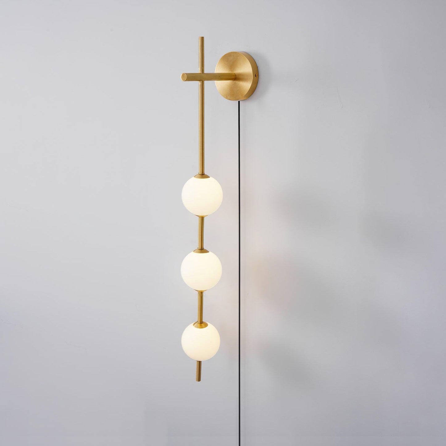 Vertical Globe Wall Lamp | Brass & Metal | Matte White Glass Shade