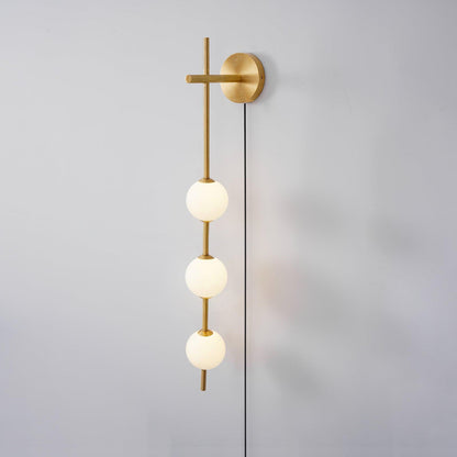 Vertical Globe Wall Lamp | Brass & Metal | Matte White Glass Shade