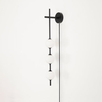 Vertical Globe Wall Lamp | Brass & Metal | Matte White Glass Shade