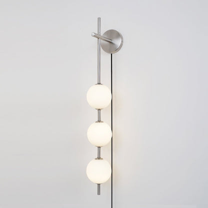 Vertical Globe Wall Lamp | Brass & Metal | Matte White Glass Shade